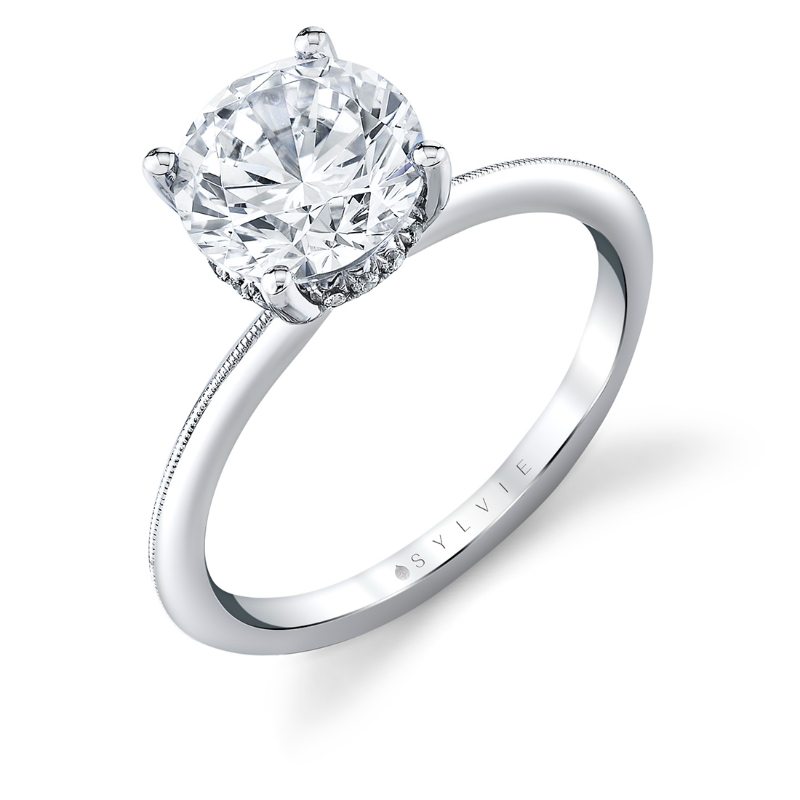 14K WHITE GOLD KNIFE EDGE SEMI MOUNT WITH A  .11CTTW SI/GH DIAMONDS IN THE HIDDEN HALO AND PRONGS FOR A 2CT ROUND